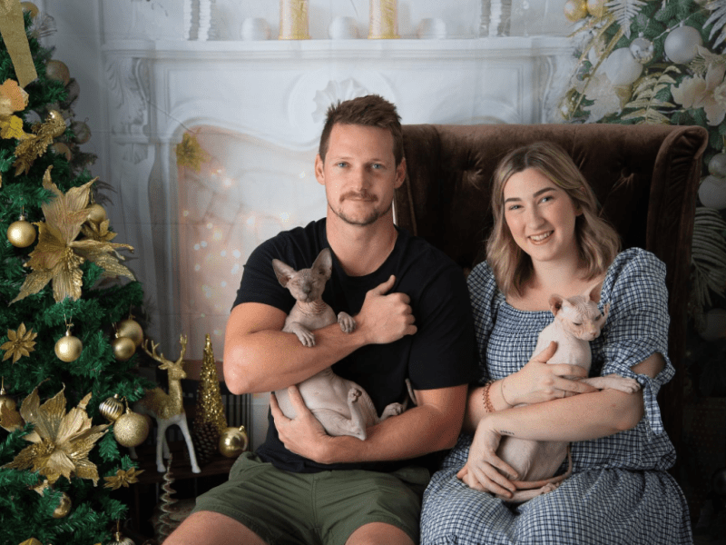 Happy Born Bold family with their two Sphynx cats
